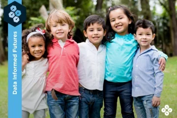 Photograph of five children smiling at the camera