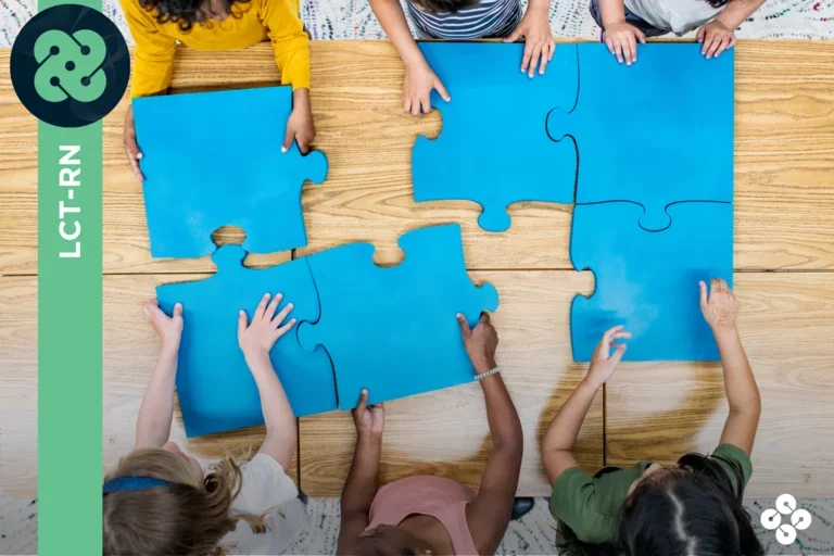 Photograph of 6 kids putting together a giant puzzle.
