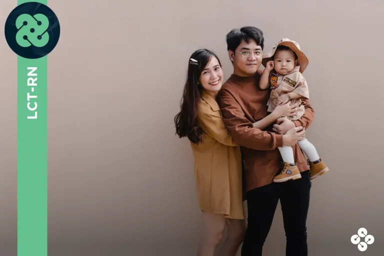Family holding their young child.