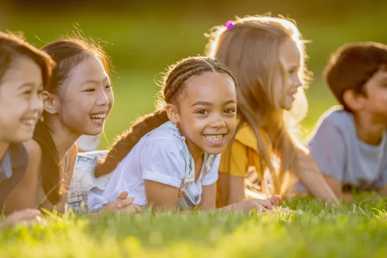 Several children at golden hour. 