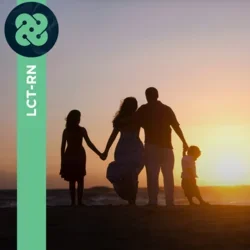 Photograph of family standing at sunset on the beach
